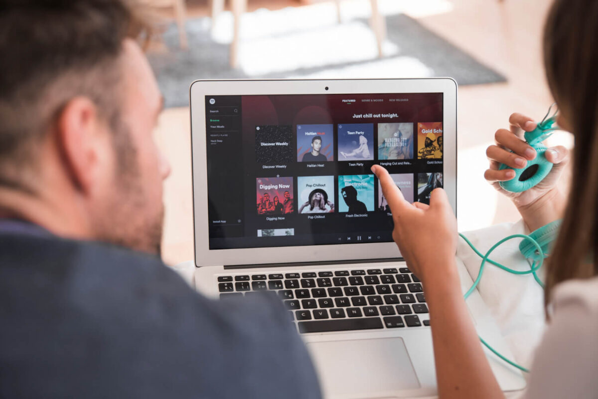 Spotify for Artists dashboard showing monthly listeners growing on a laptop