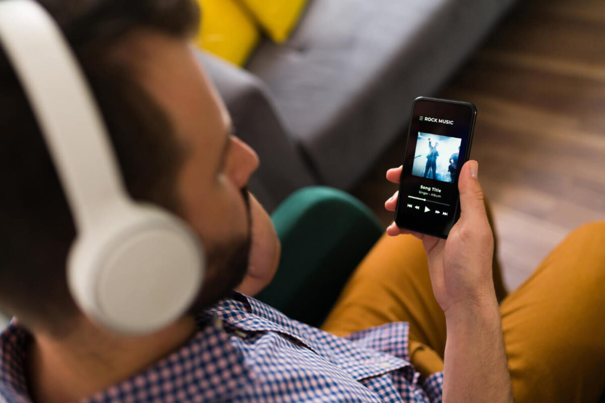 A looping Spotify Canvas video playing behind a song in the Now Playing view