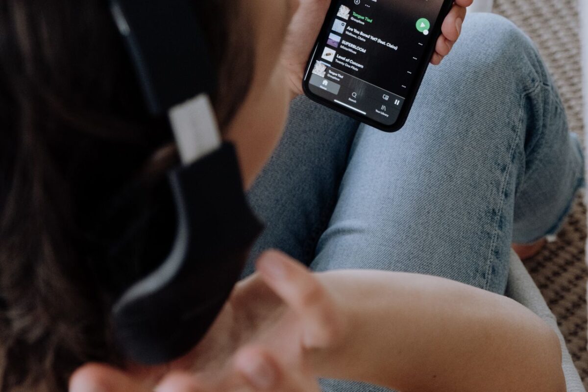Fan pre-saving an upcoming song on Spotify from a phone