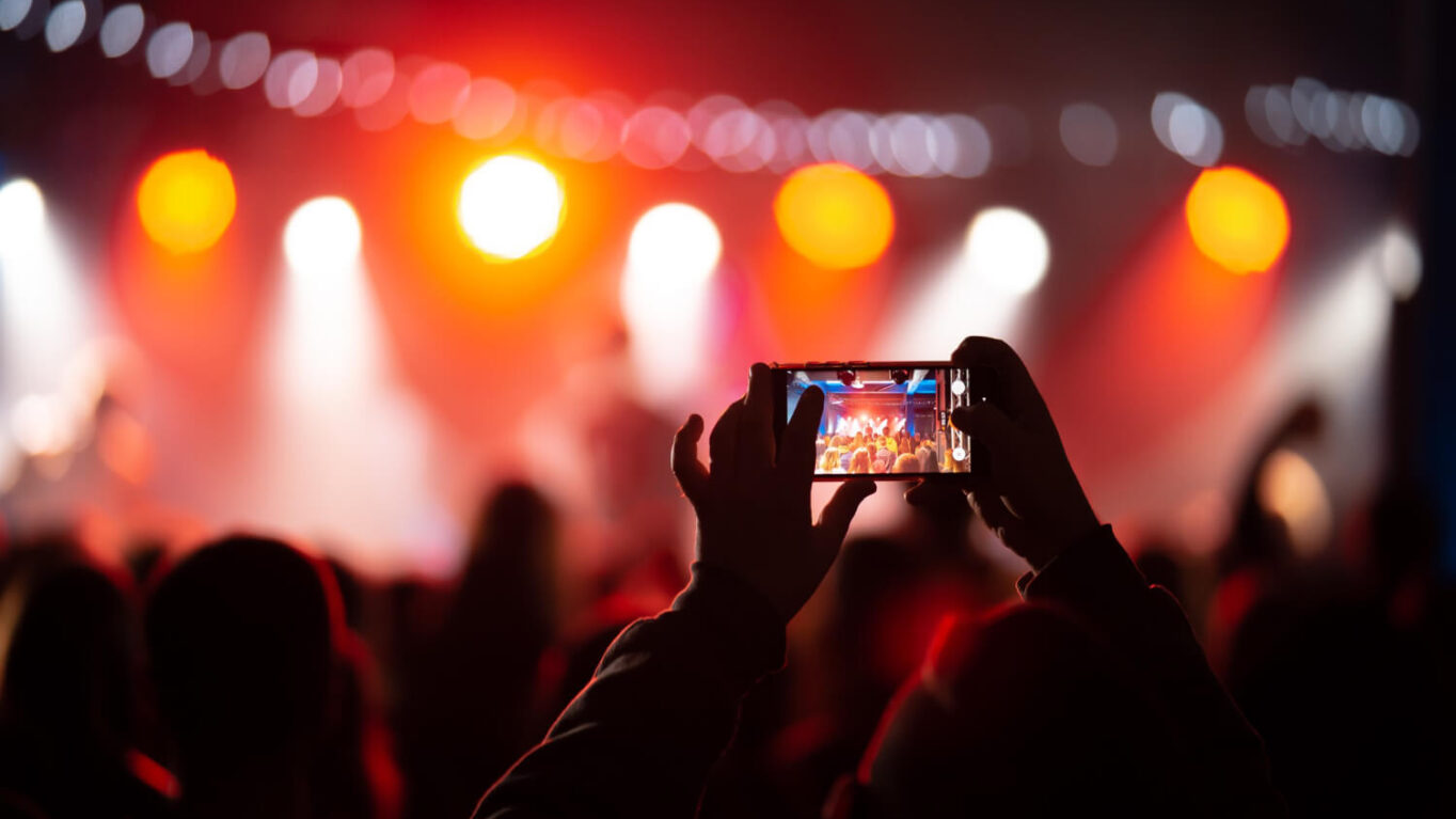 Smartphone showing a short-form video music feed, representing TikTok's role in 2026 music discovery
